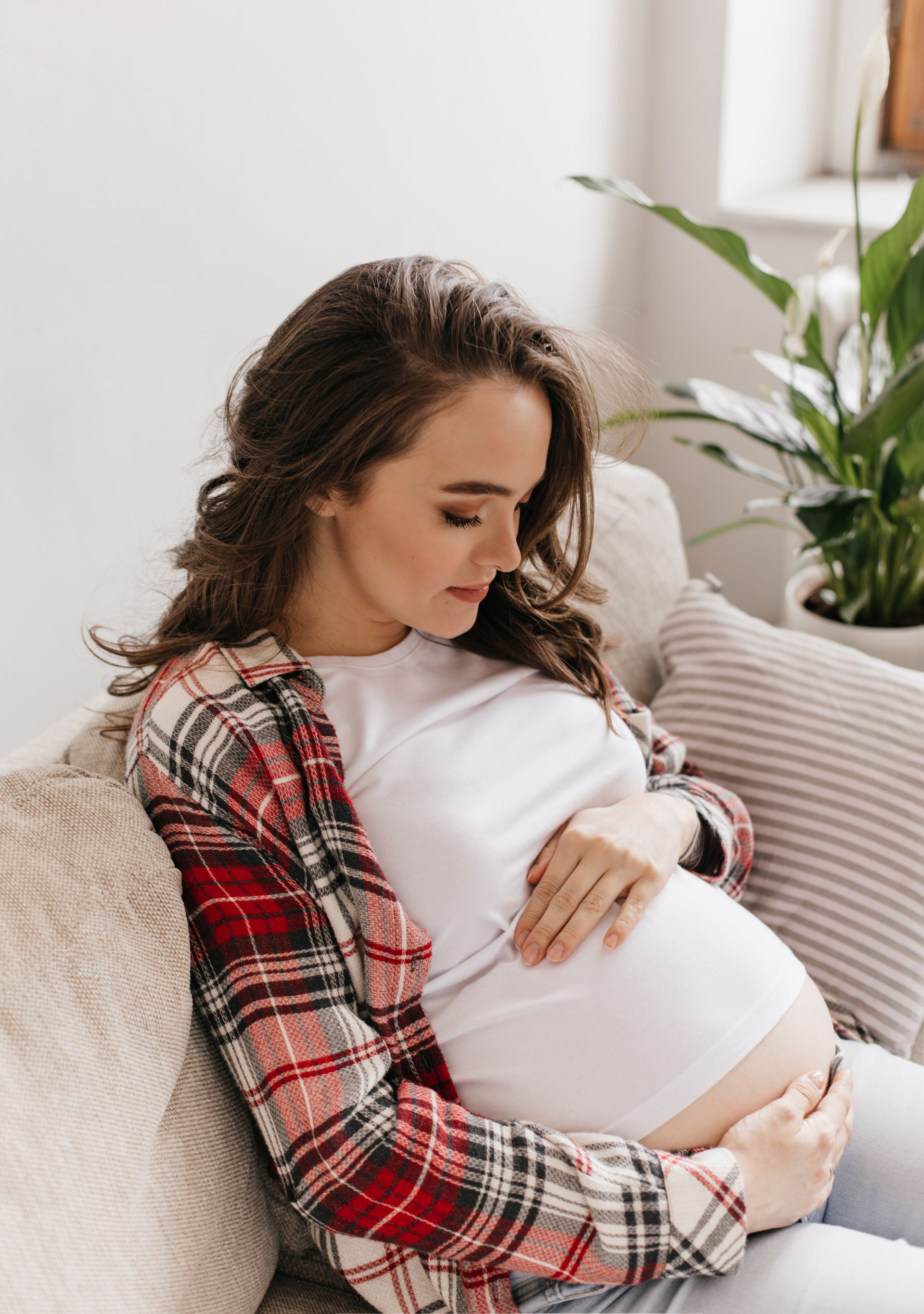 Pregnant woman holding her belly