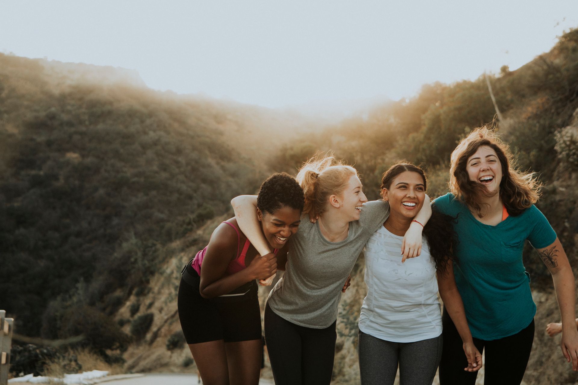 Three women posing and smiling