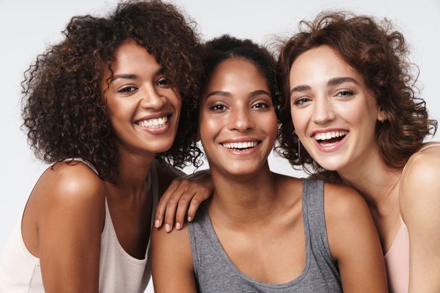 Three women smiling together