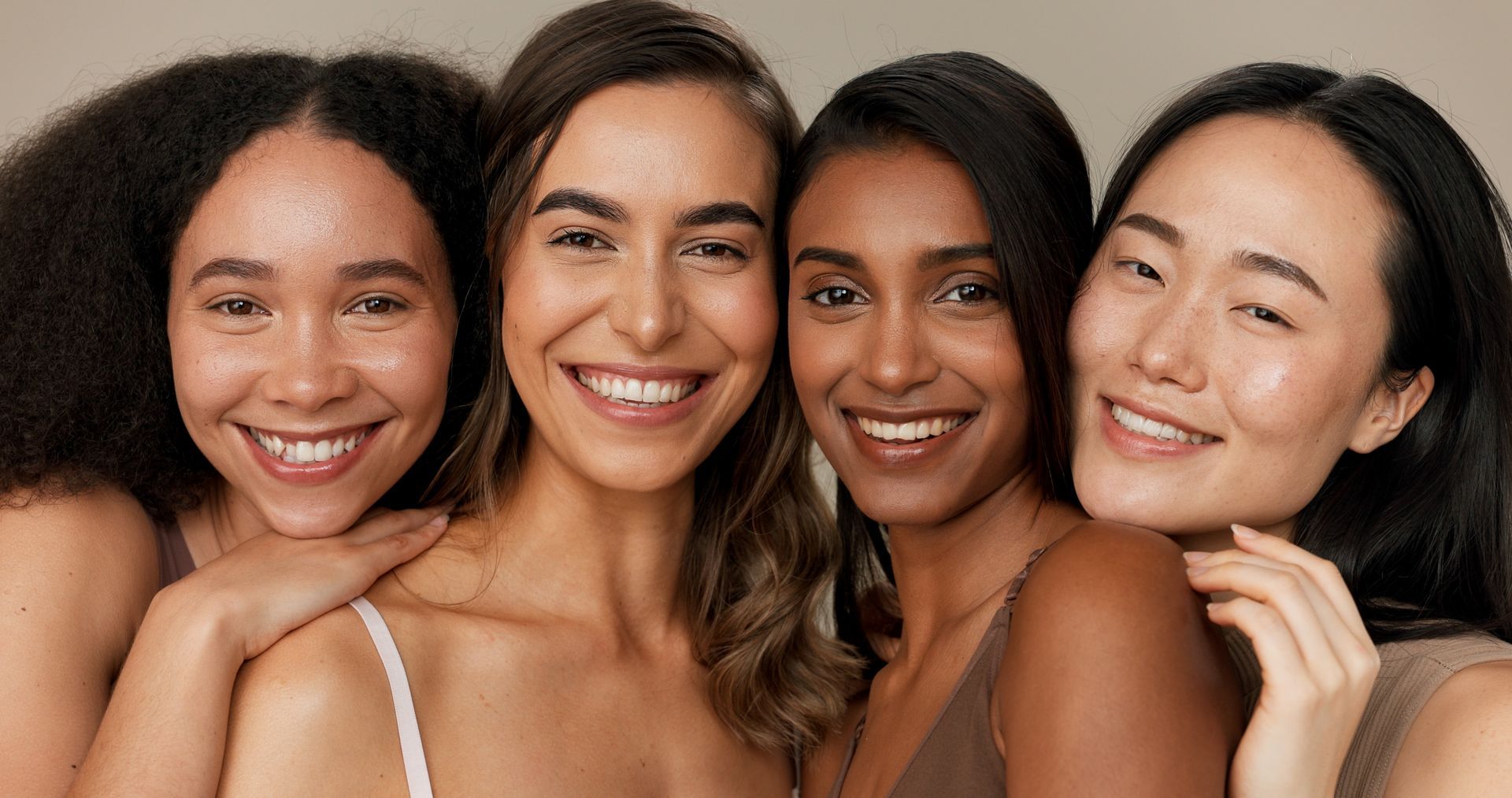 A group of diverse women smiling together