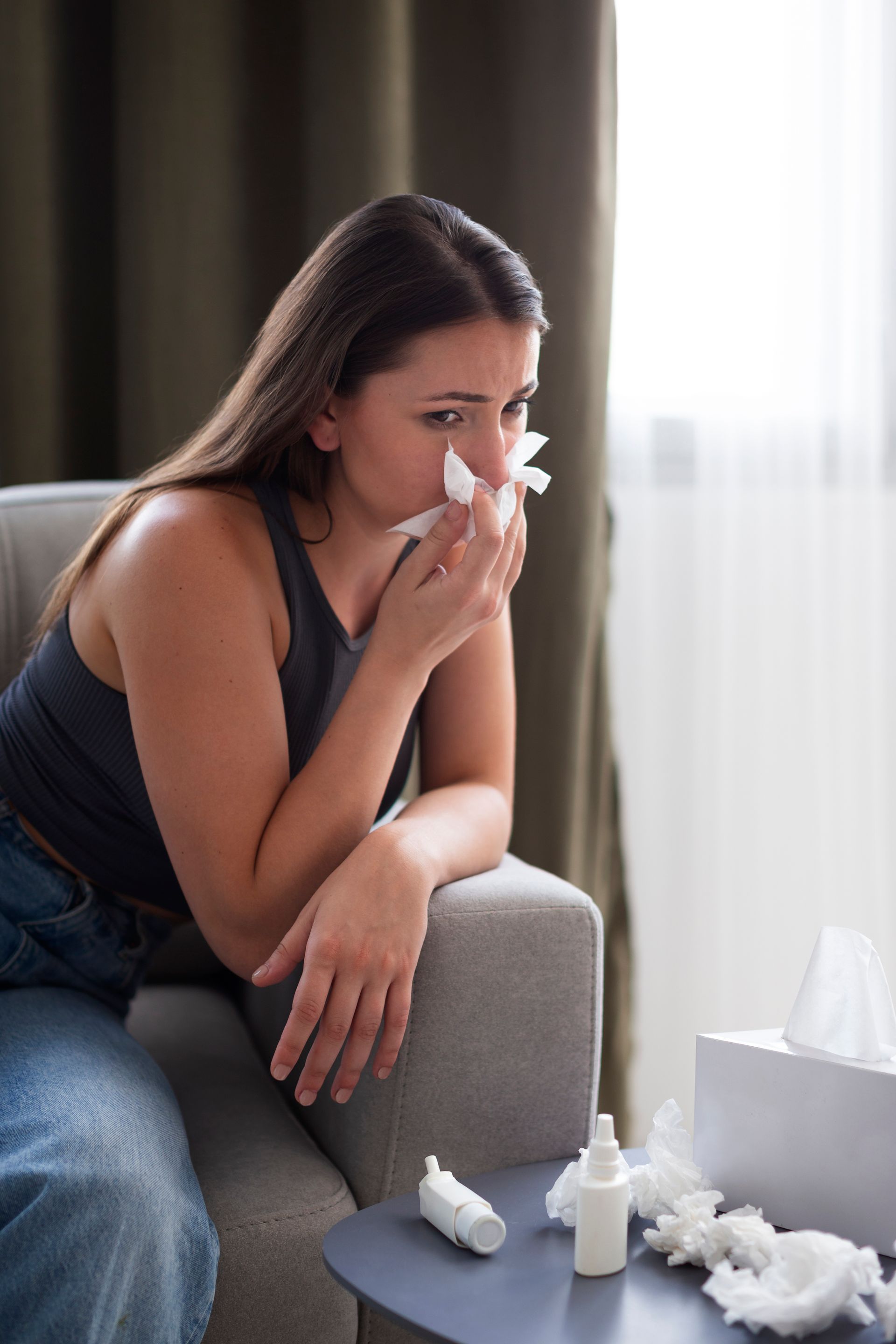 Woman blowing her nose
